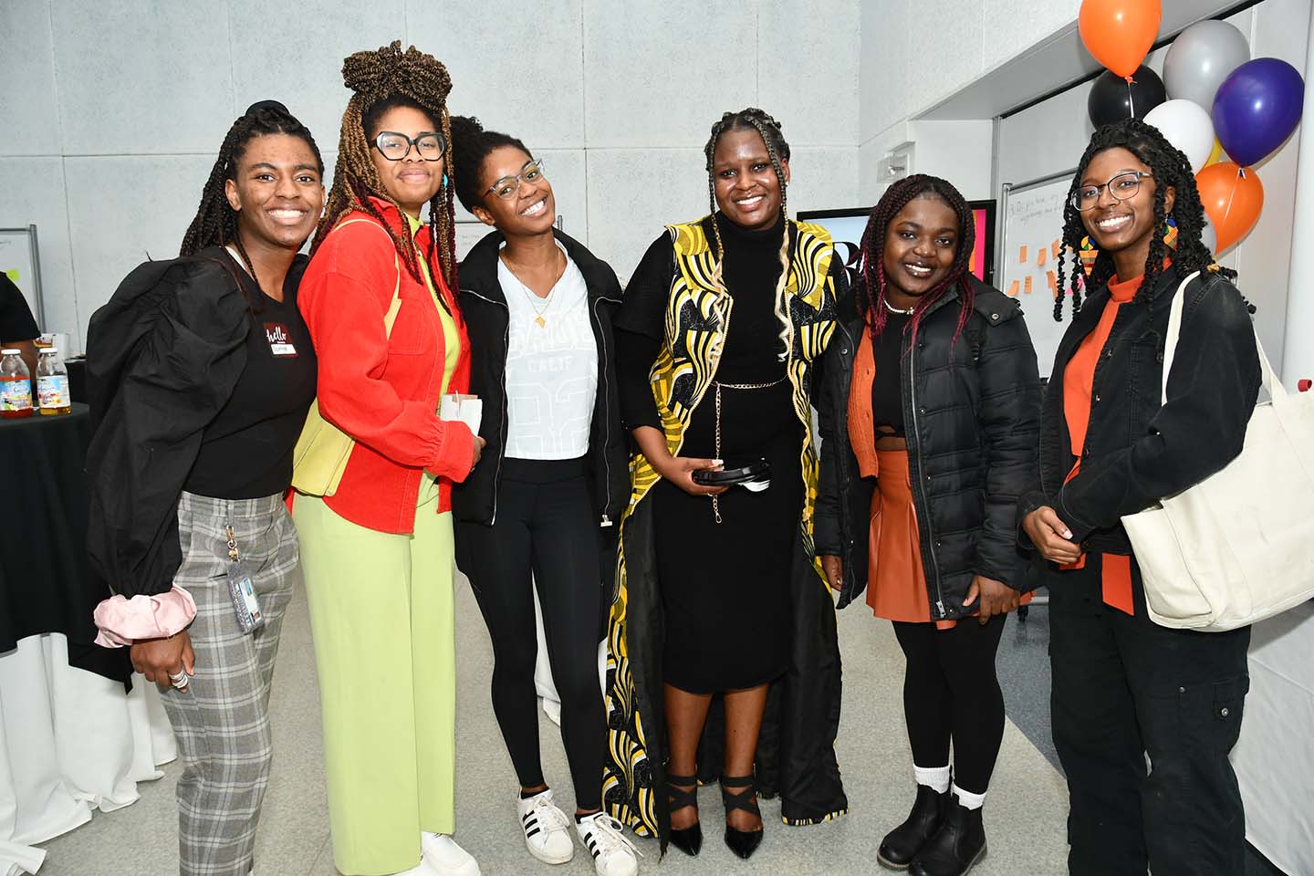 A group of smiling students and attendees at the Black at UTM launch event